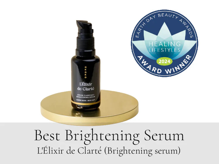 OKOKO Cosmétiques L’Élixir de Clarté — award-winning brightening serum recognized as Best Brightening Serum 2024 by Healing Lifestyles Earth Day Beauty Awards. A vitamin C and blue light defense serum crafted with AHA fruit acids and niacinamide, representing Intelligent Luxury Skincare™ innovation